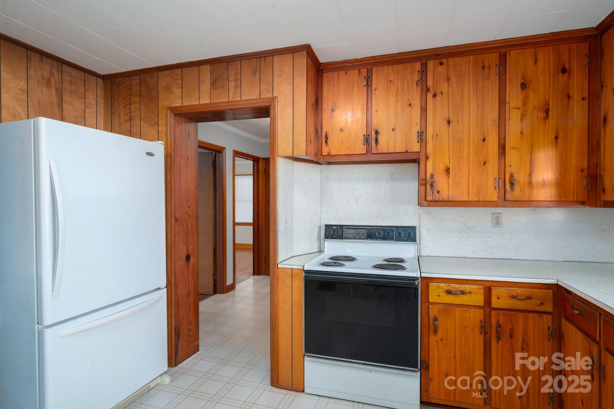 897 Calloway Road Lincolnton, NC 28092 - Photo 19 of 40 a kitchen with stainless steel appliances granite countertop a refrigerator and a stove
