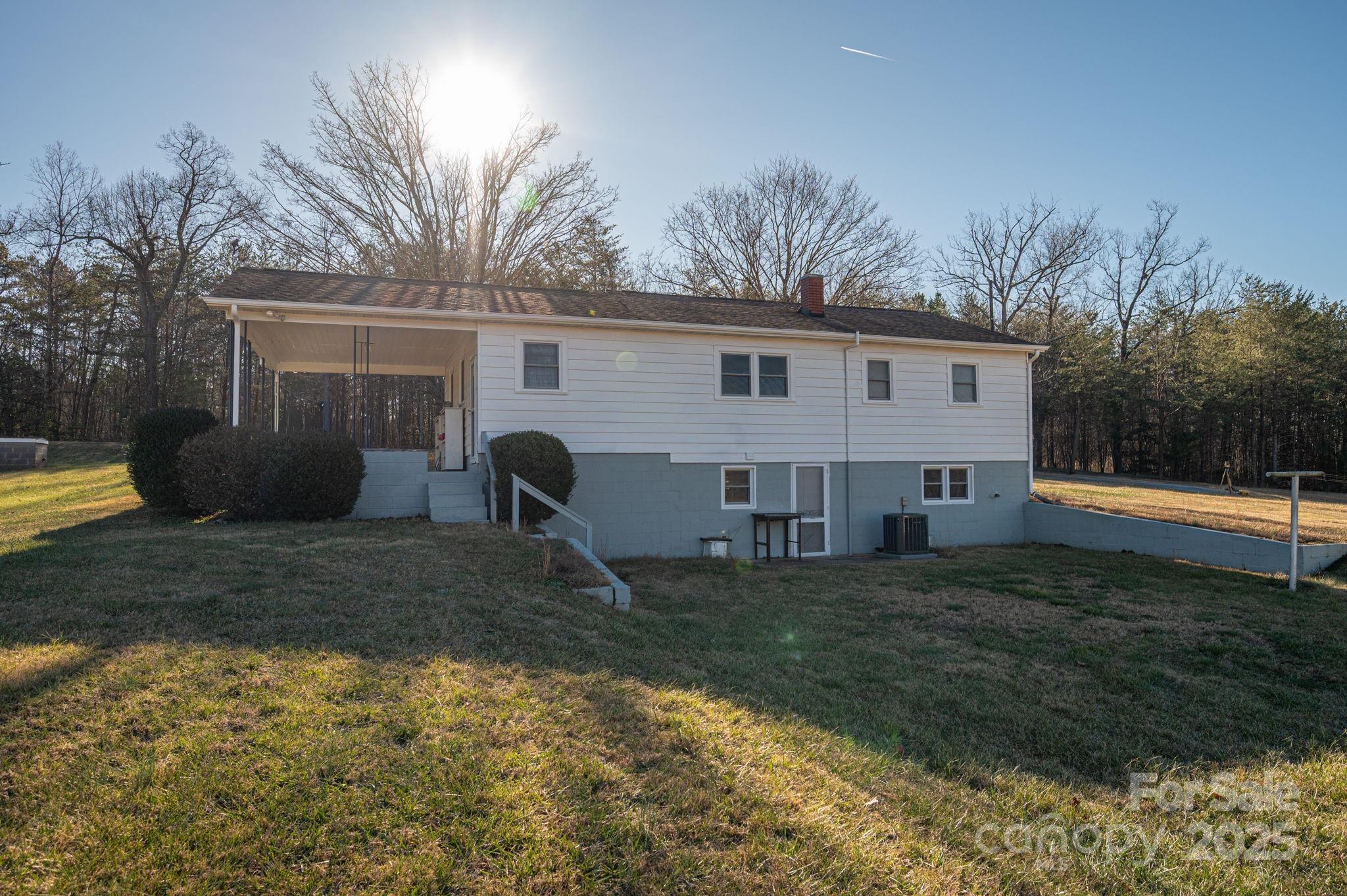 897 Calloway Road Lincolnton, NC 28092 - Photo 38 of 40 a view of a house with backyard and sitting area