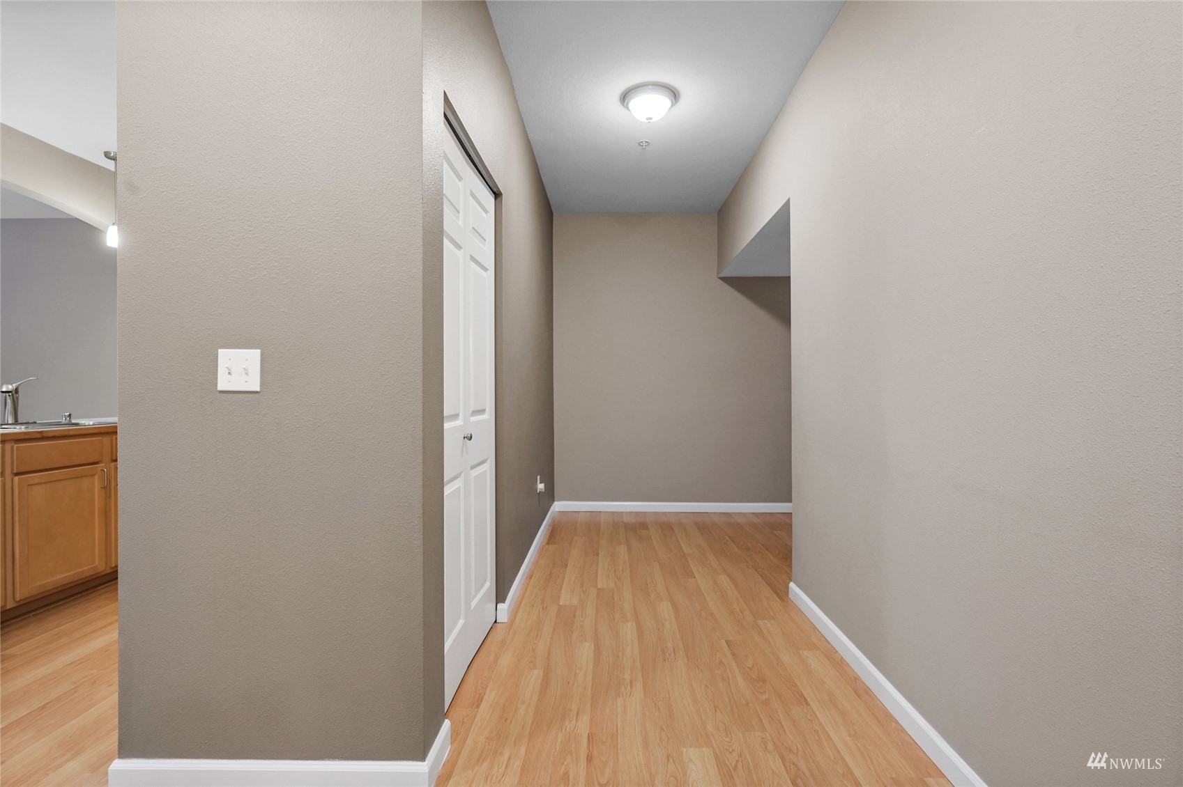 14335 Simonds Road Northeast, Unit A302 Kirkland, WA 98034 - Photo 15 of 25 a view of hallway with wooden floor