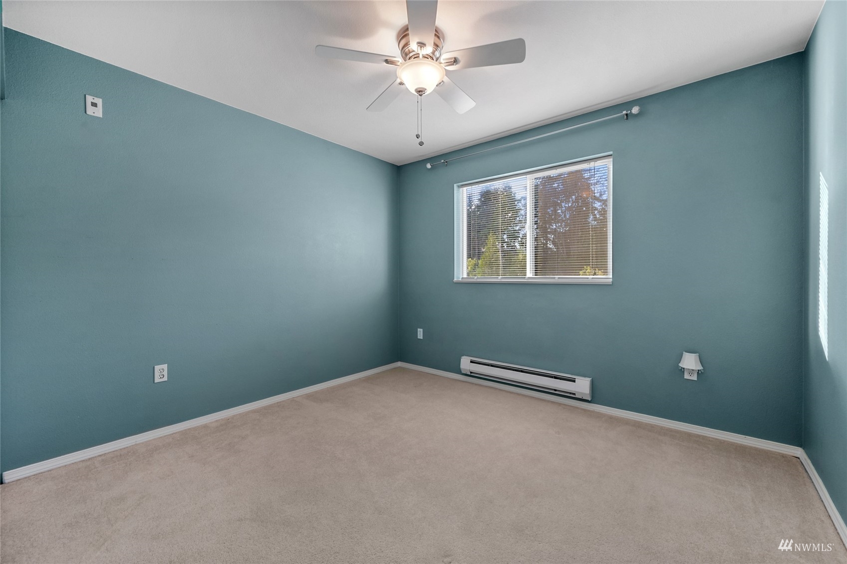 14335 Simonds Road Northeast, Unit A302 Kirkland, WA 98034 - Photo 17 of 25 an empty room with windows and fan