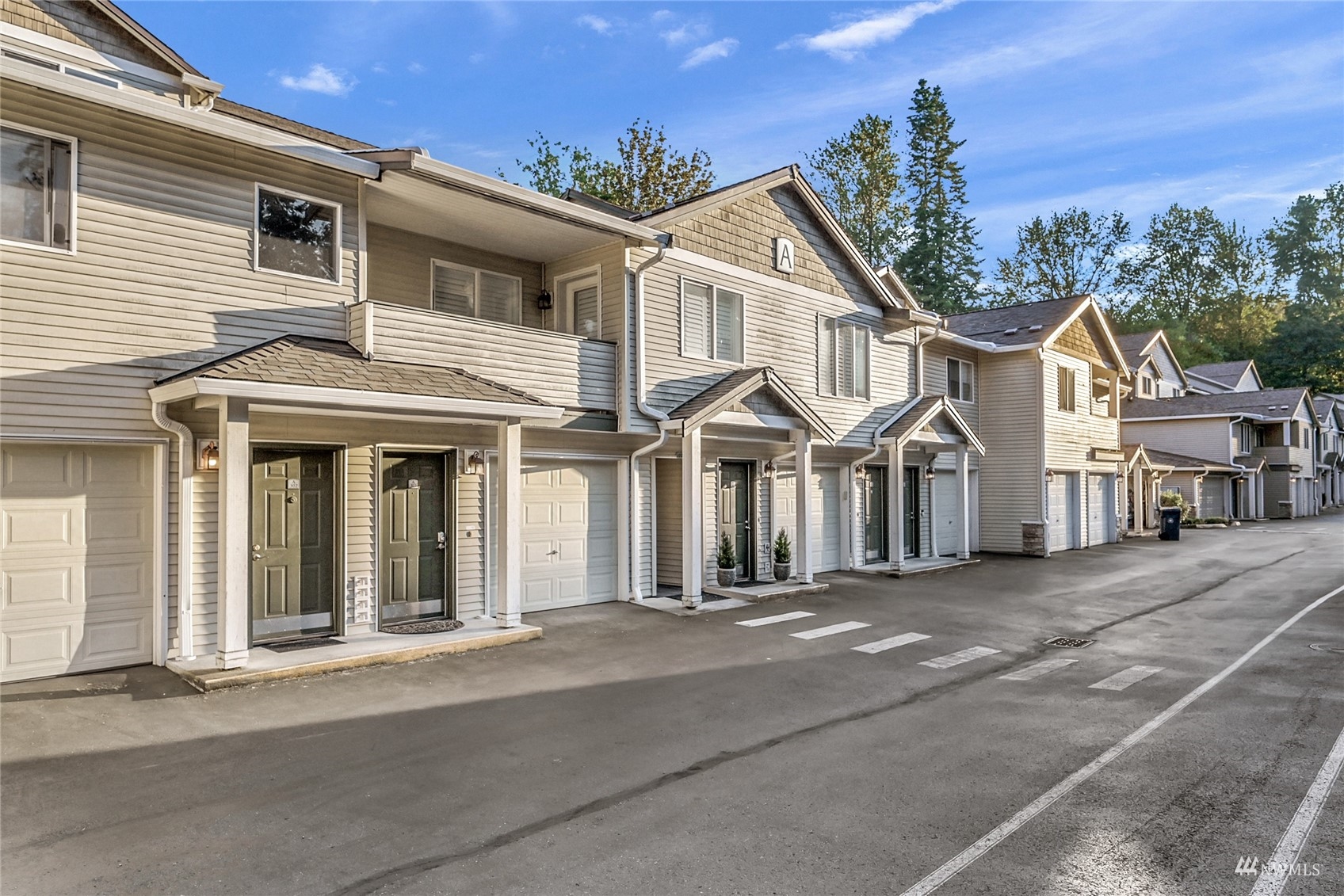 14335 Simonds Road Northeast, Unit A302 Kirkland, WA 98034 - Photo 2 of 25 front view of a house with a street
