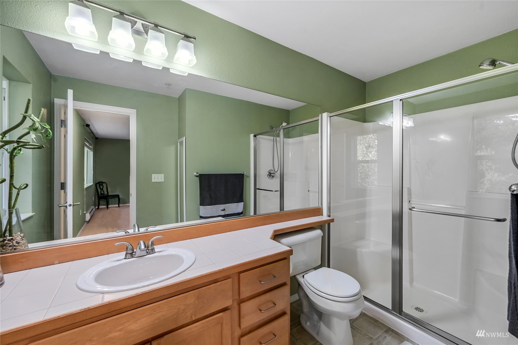 14335 Simonds Road Northeast, Unit A302 Kirkland, WA 98034 - Photo 22 of 25 a bathroom with a sink toilet and shower