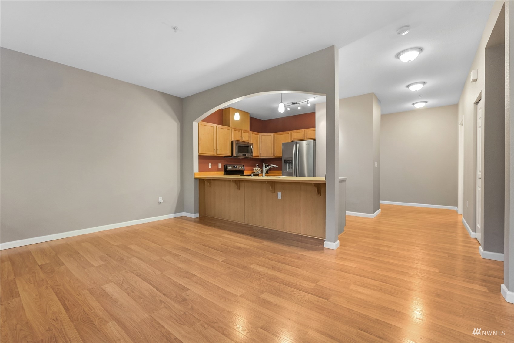 14335 Simonds Road Northeast, Unit A302 Kirkland, WA 98034 - Photo 6 of 25 a view of a kitchen with a sink and cabinets