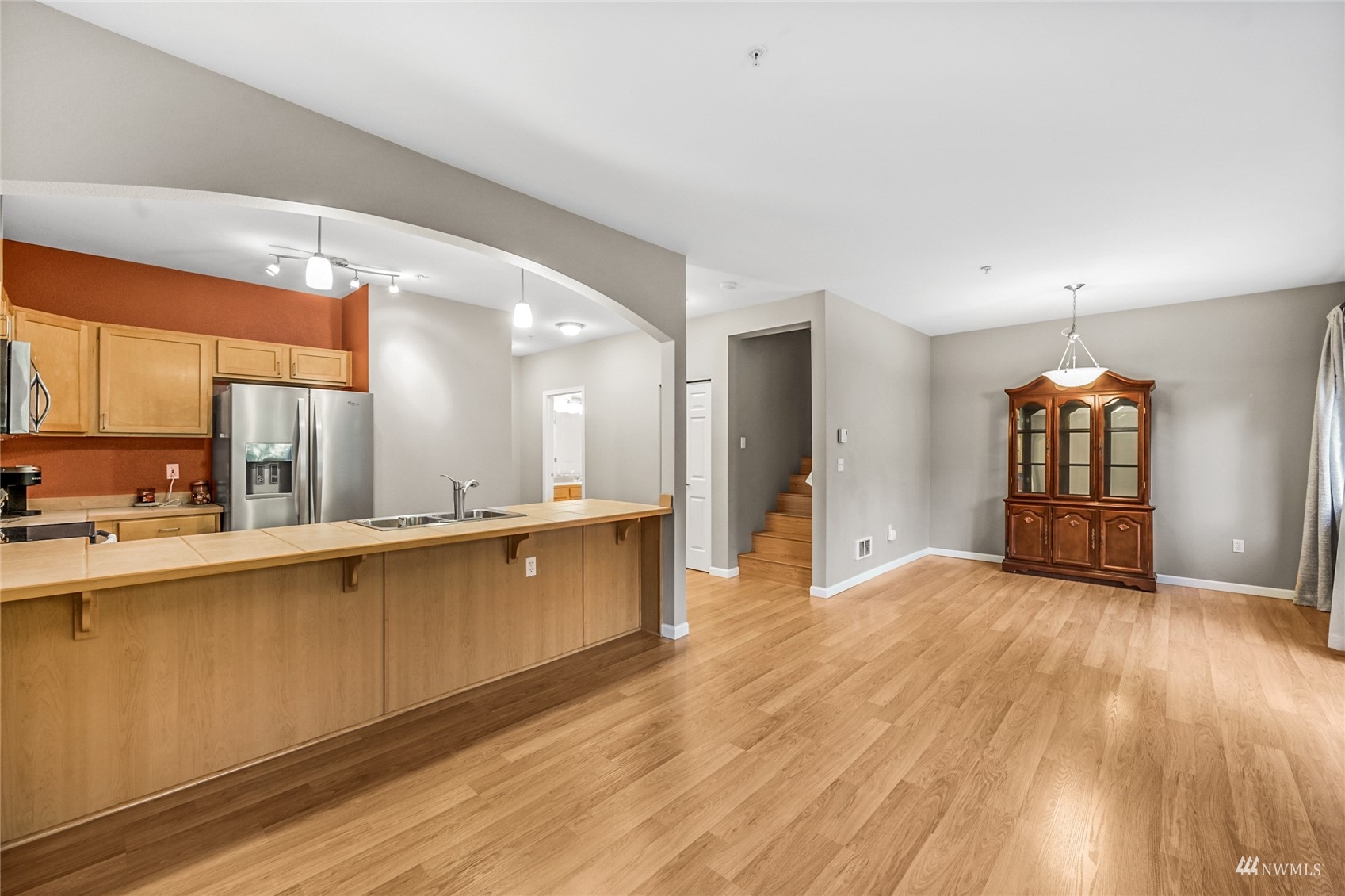 14335 Simonds Road Northeast, Unit A302 Kirkland, WA 98034 - Photo 7 of 25 a view of wooden floor and windows in a room