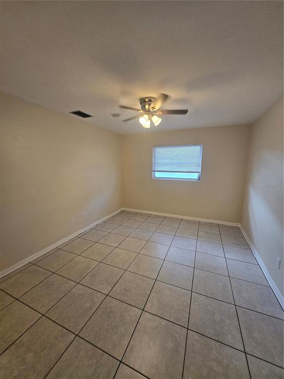 830 Highland Avenue, Unit 2 Largo, FL 33770 - Photo 9 of 13 a view of an empty room with a window