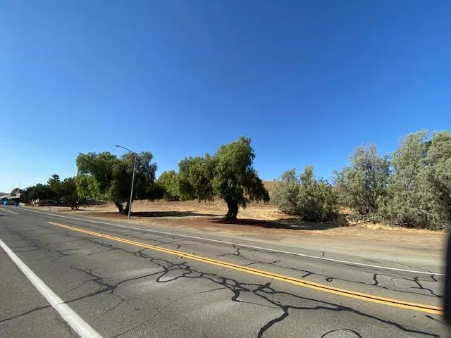 a view of a street with cars on road