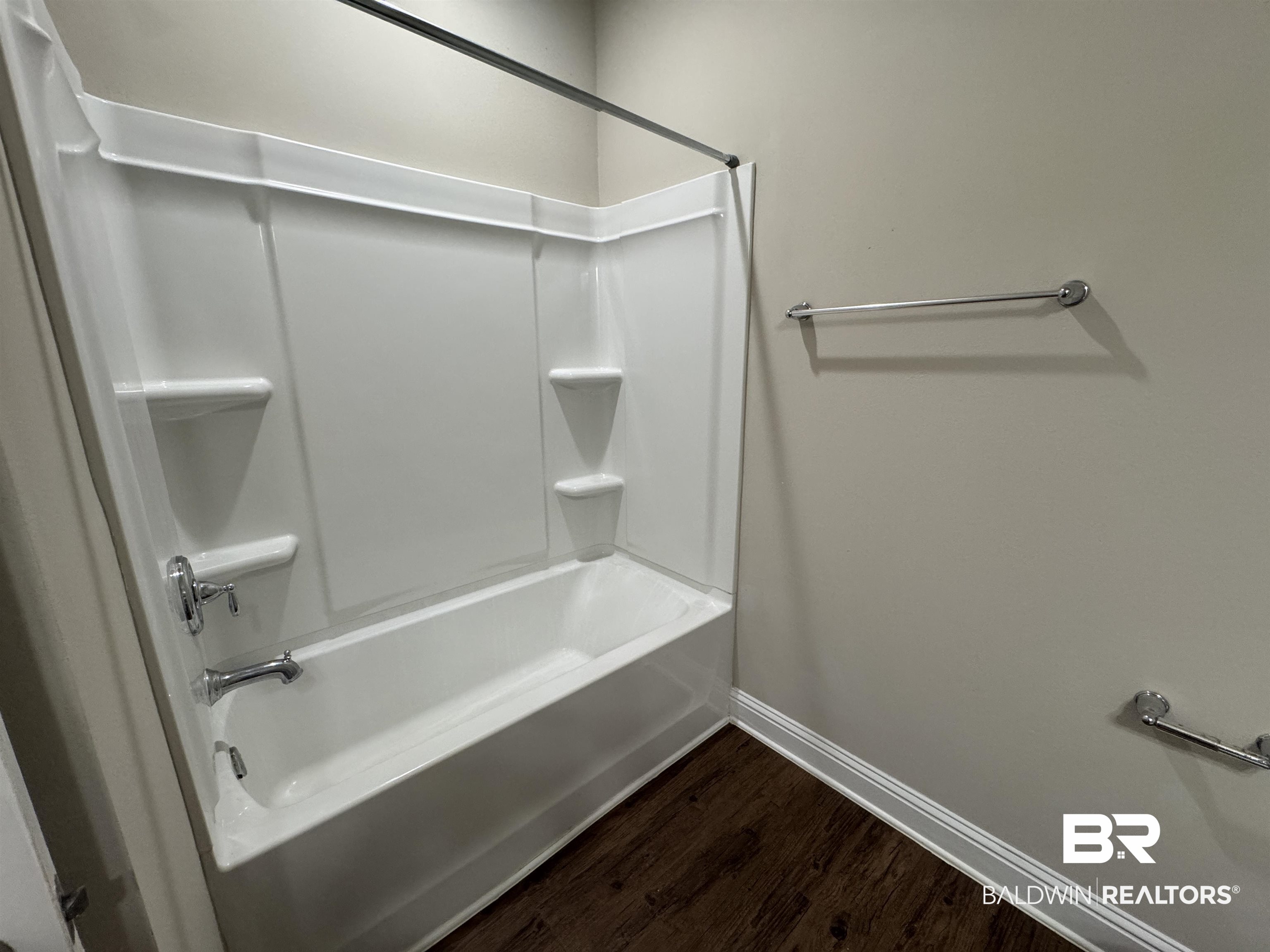 6811 Spaniel Drive, Unit C Daphne, AL 36527 - Photo 18 of 33 Full bathroom with baseboards, wood finished floors, and shower / tub combination