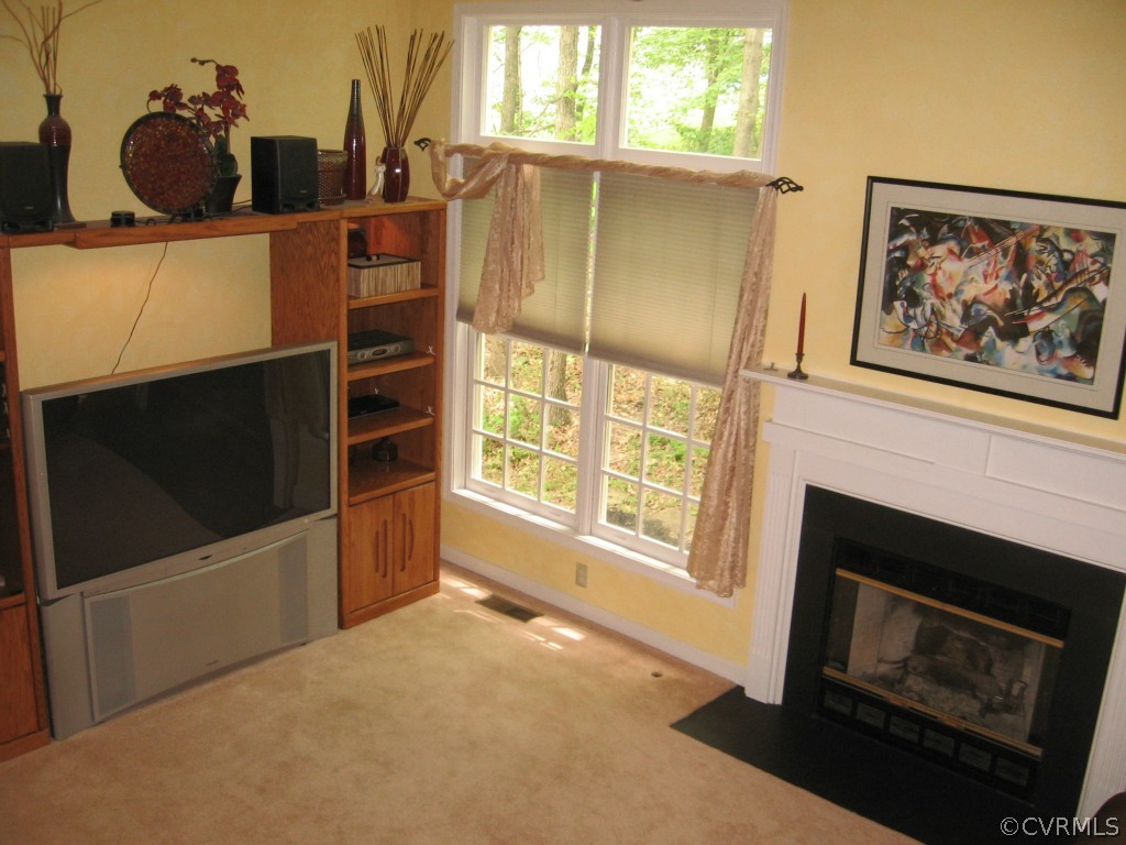 6215 Heather Glen Road Midlothian, VA 23112 - Photo 4 of 20 a living room with furniture and a fireplace