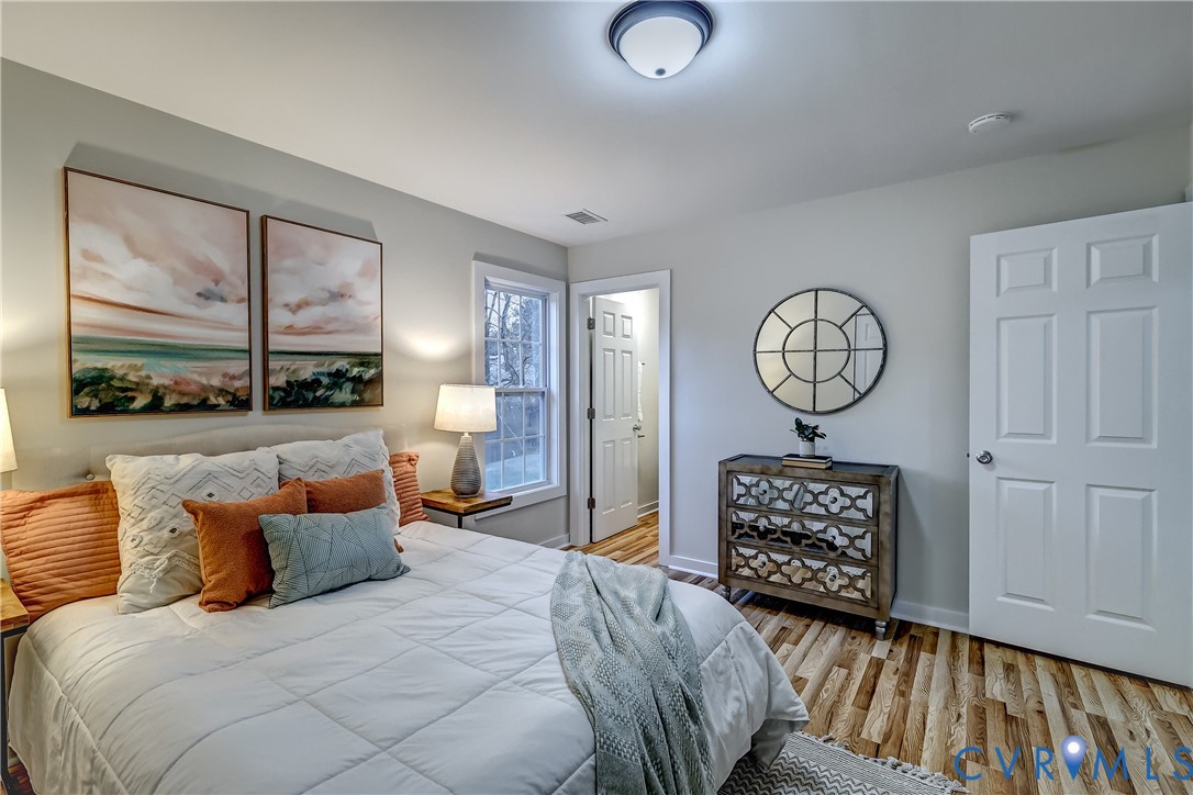 12301 Beaver Point Drive Midlothian, VA 23112 - Photo 23 of 24 a bedroom with a bed and wooden floor