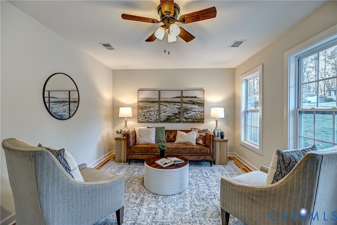 12301 Beaver Point Drive Midlothian, VA 23112 - Photo 5 of 24 a living room with furniture and a large window
