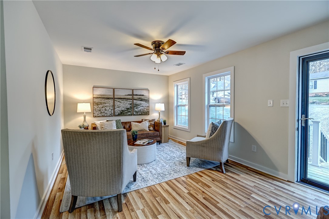 12301 Beaver Point Drive Midlothian, VA 23112 - Photo 6 of 24 a living room with furniture and a large window