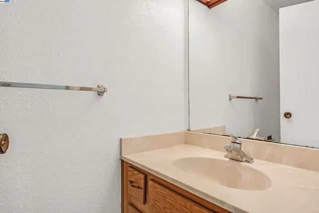 a bathroom with a sink and mirror