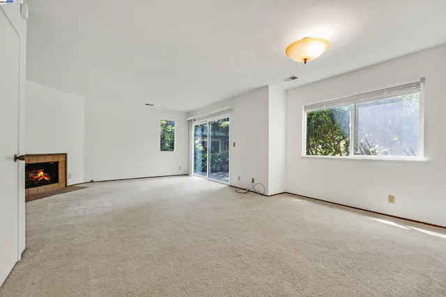 a kitchen with a stove sink and cabinets