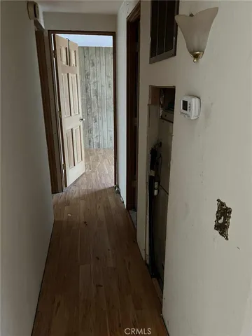 a view of bedroom with a closet and wooden floor