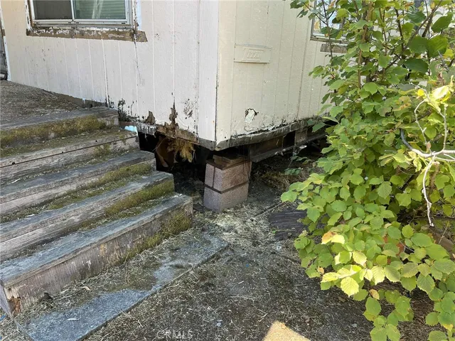 a view of a backyard with chairs