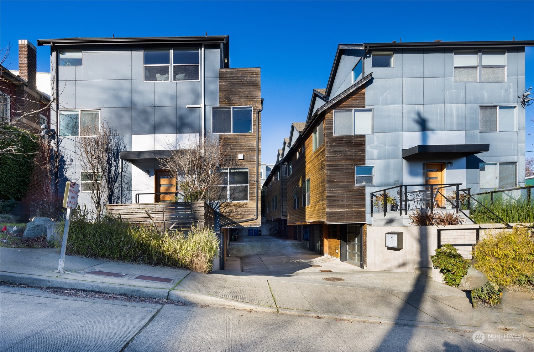 a front view of a house with large windows