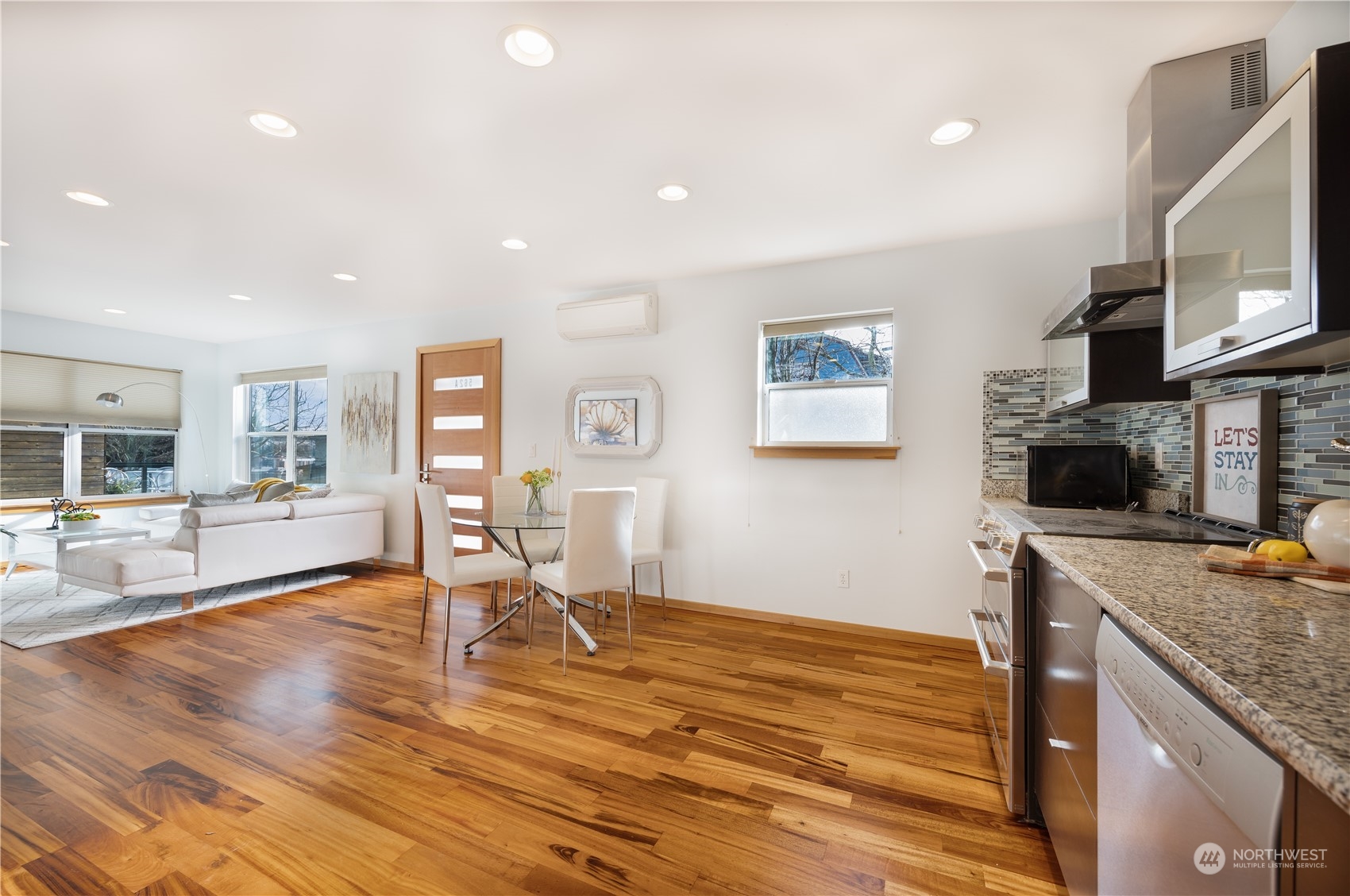 562 Galer Street, Unit A Seattle, WA 98109 - Photo 12 of 30 a living room with furniture and a flat screen tv