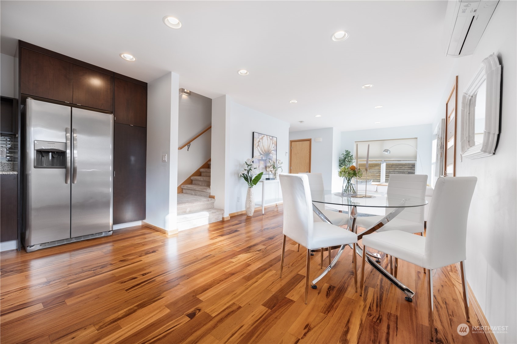 562 Galer Street, Unit A Seattle, WA 98109 - Photo 14 of 30 a view of a dining room with furniture and wooden floor