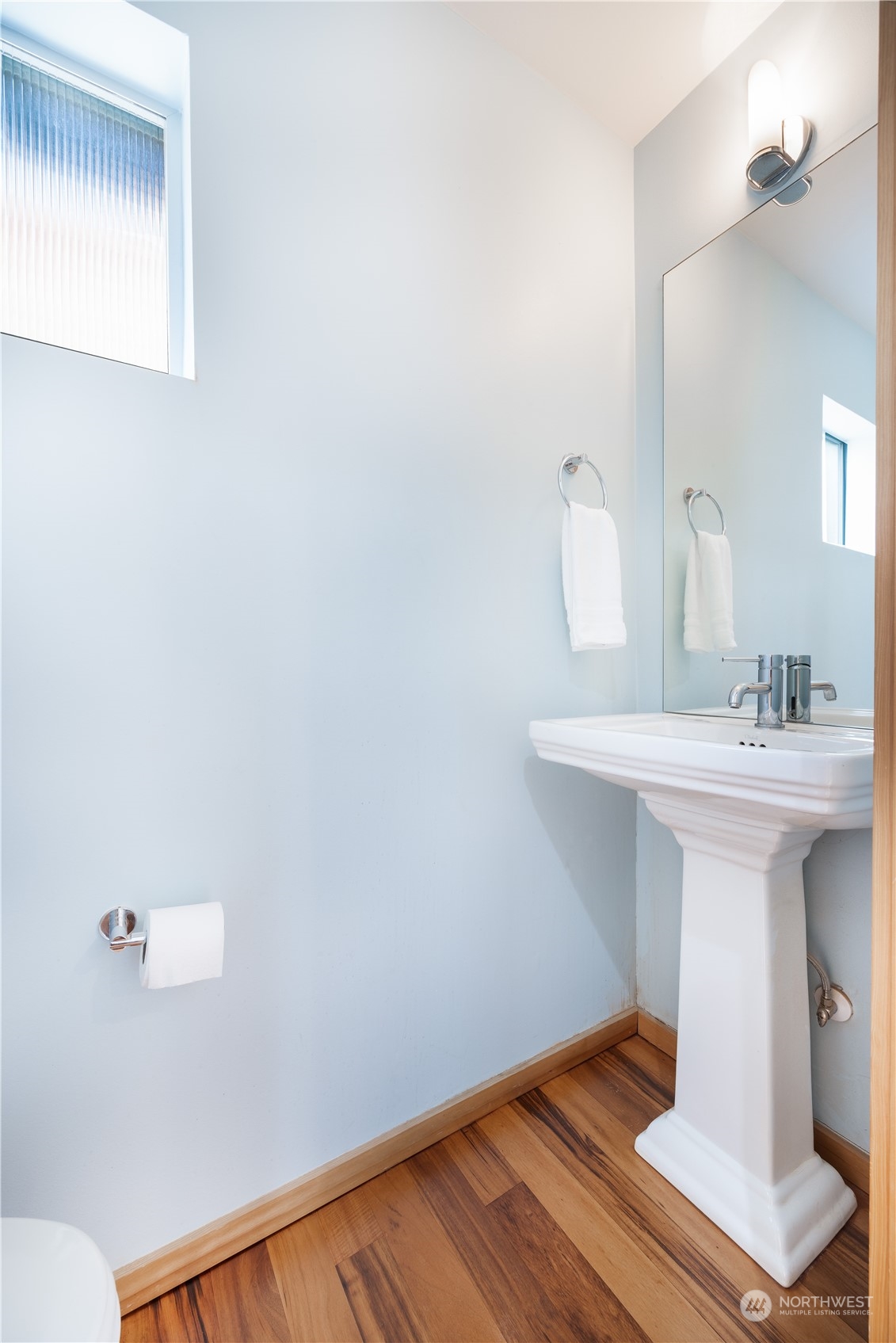 562 Galer Street, Unit A Seattle, WA 98109 - Photo 15 of 30 a bathroom with a sink mirror and toilet