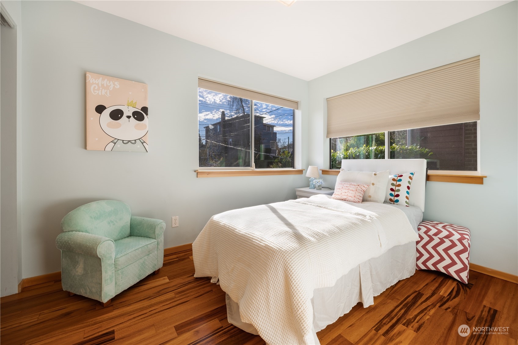 562 Galer Street, Unit A Seattle, WA 98109 - Photo 16 of 30 a bedroom with a bed and a painting on the wall