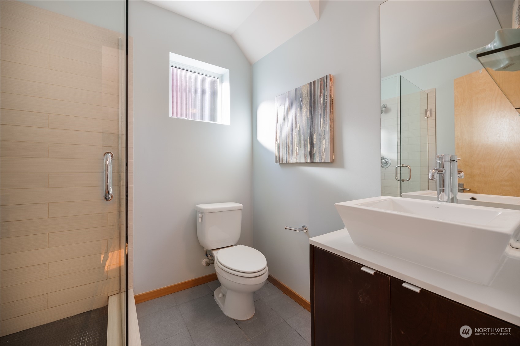 562 Galer Street, Unit A Seattle, WA 98109 - Photo 18 of 30 a white toilet sitting next to a bathroom sink