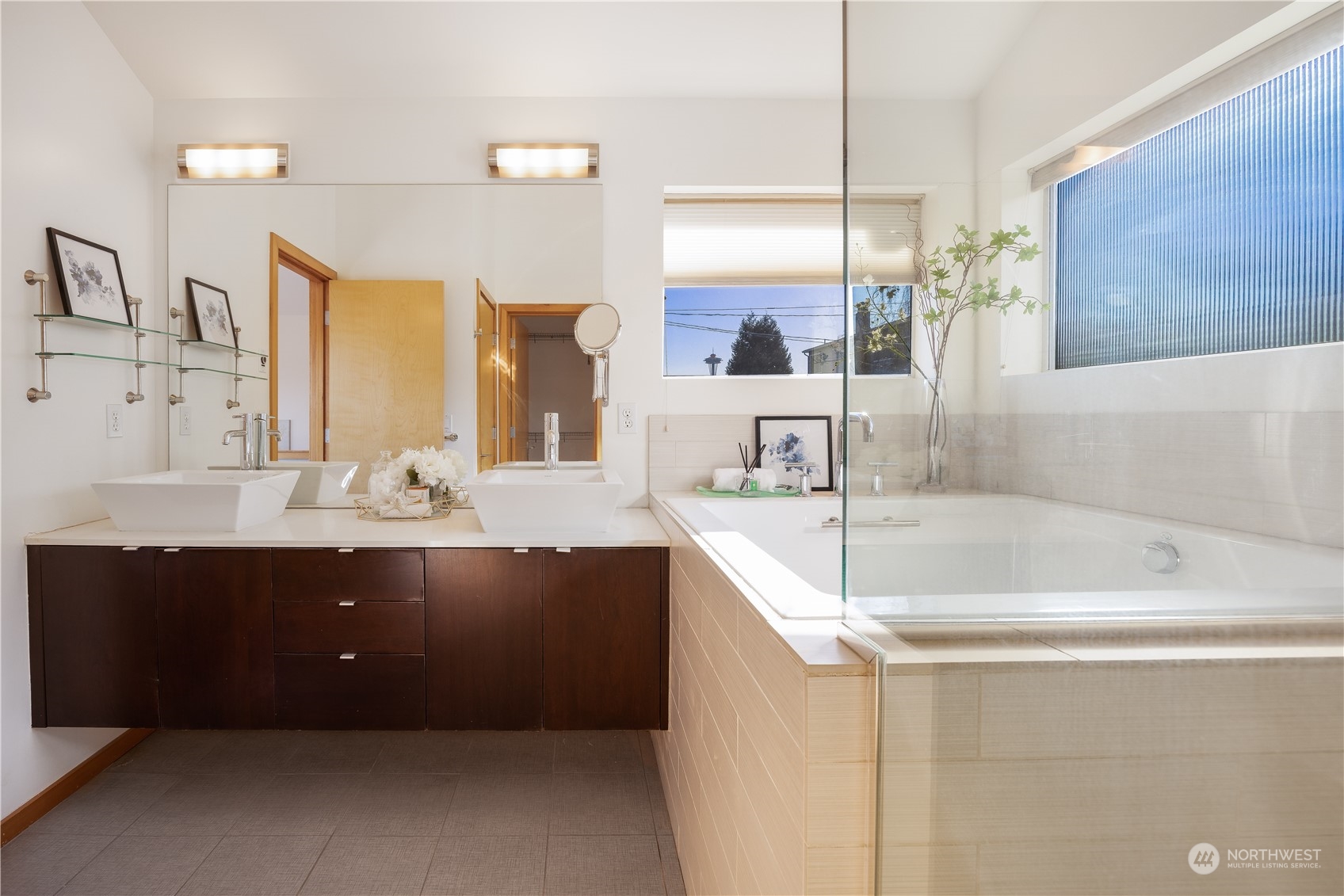 562 Galer Street, Unit A Seattle, WA 98109 - Photo 23 of 30 a bathroom with a bathtub sink and mirror
