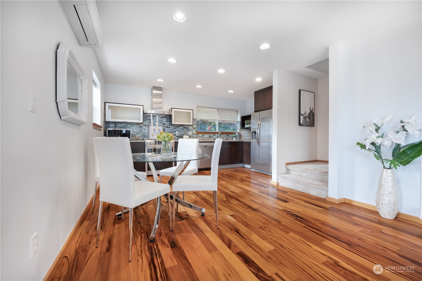 562 Galer Street, Unit A Seattle, WA 98109 - Photo 9 of 30 a view of a dining room with furniture and wooden floor