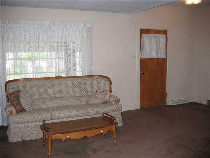 411 Vermont Avenue Rochester, PA 15074 - Photo 2 of 16 Living Room. When you enter this large livingroom you may wonder if there are hardwood floor under the carpet. There are!