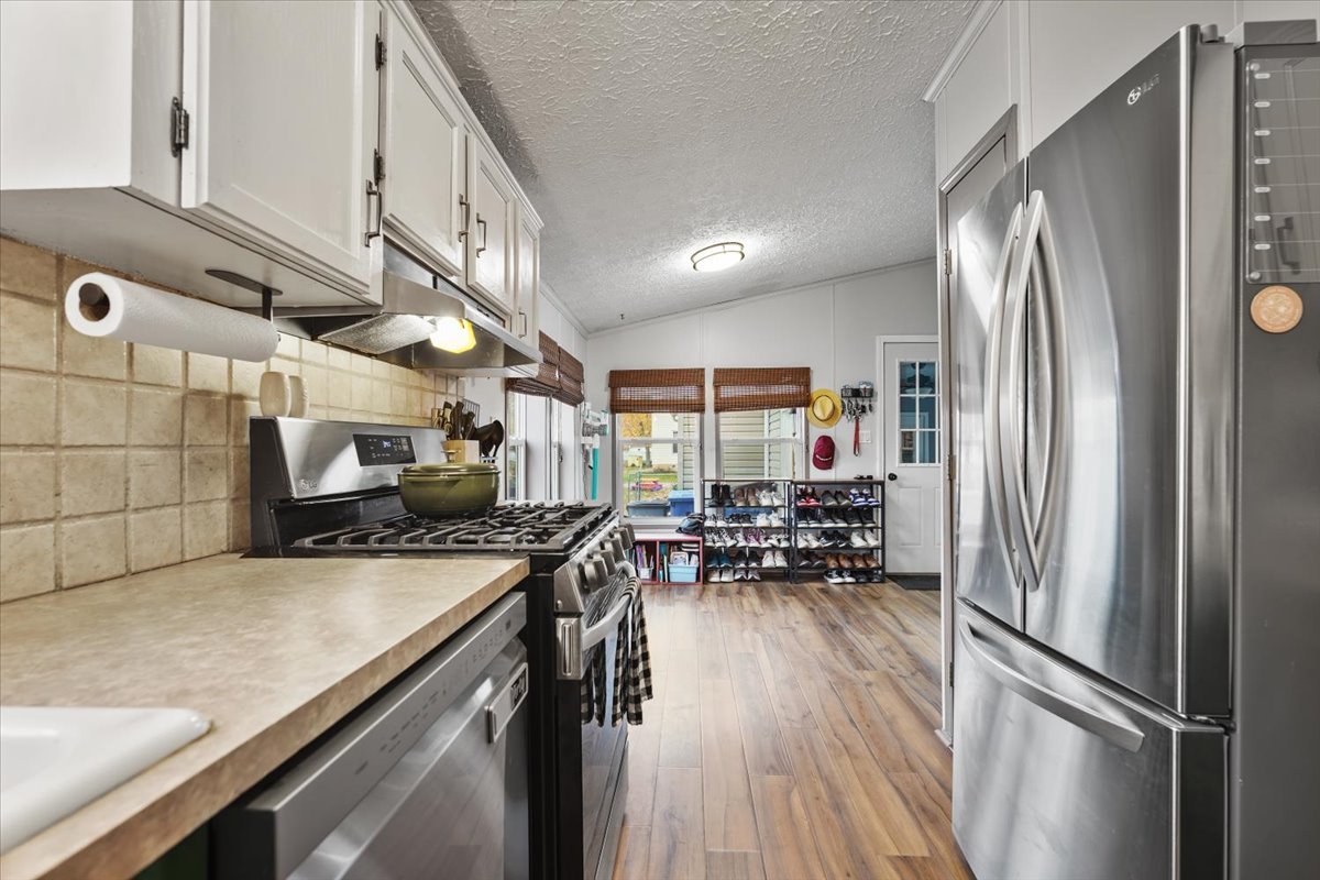 602 West 6th Street Minonk, IL 61760 - Photo 11 of 32 a kitchen with sink cabinets and stainless steel appliances