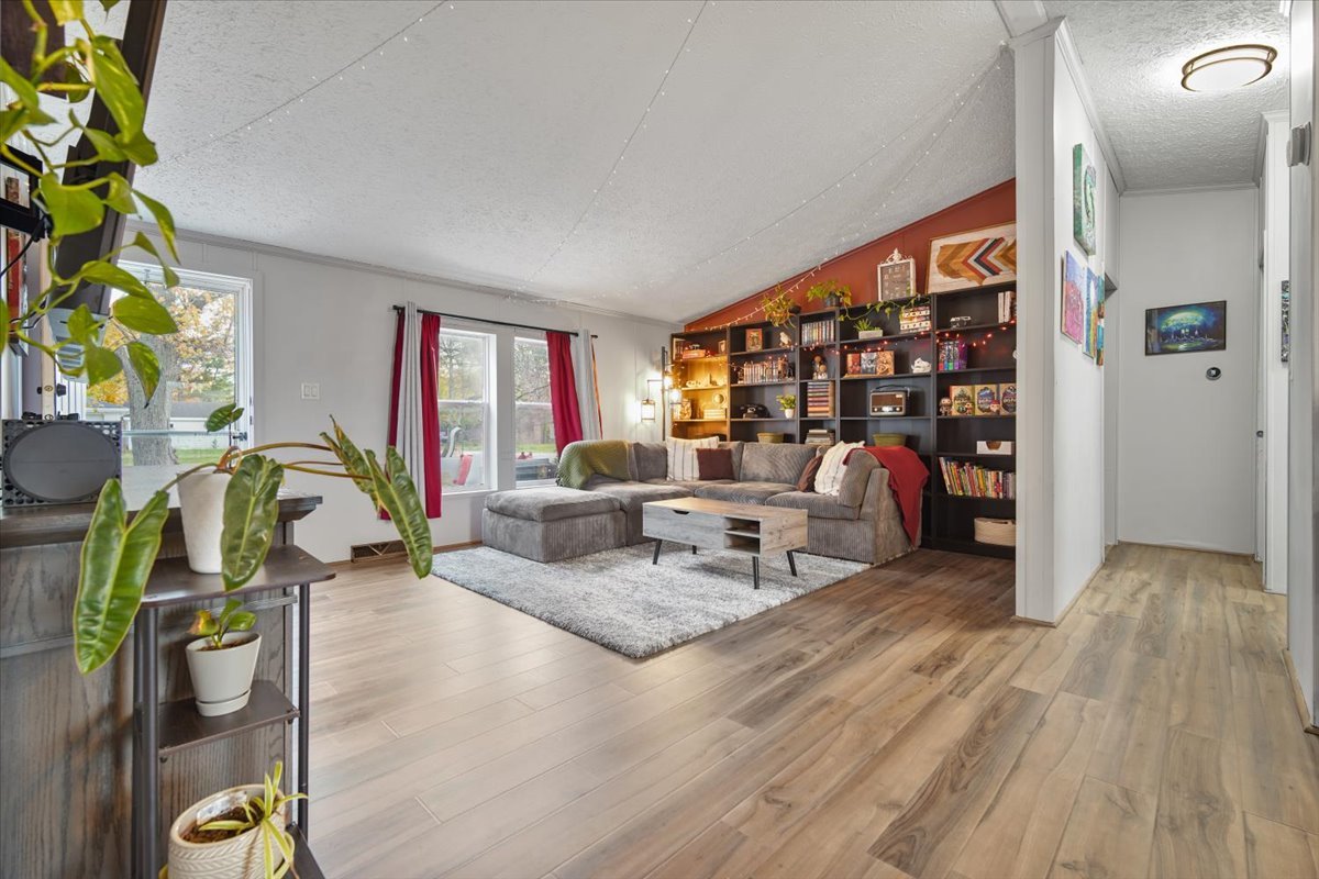 602 West 6th Street Minonk, IL 61760 - Photo 6 of 32 a living room with furniture a rug and a potted plant