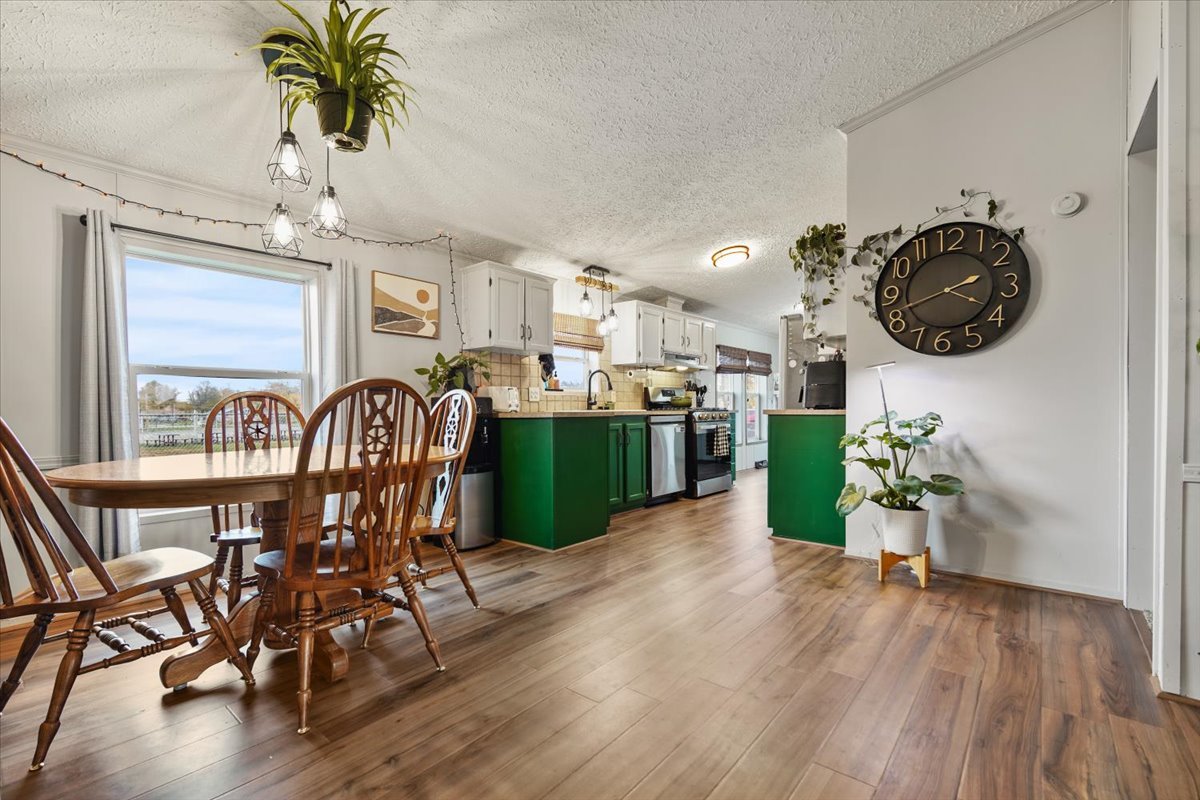 602 West 6th Street Minonk, IL 61760 - Photo 9 of 32 a view of a dining room with furniture and wooden floor