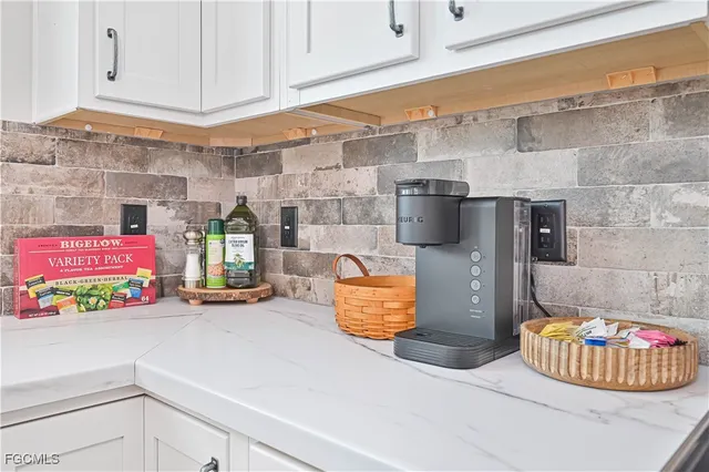 a kitchen with a sink and a stove