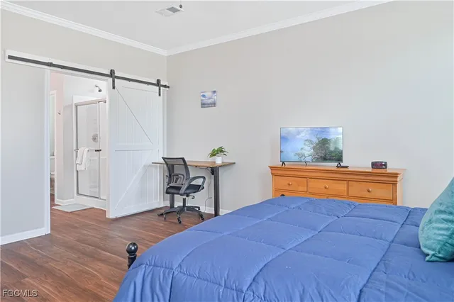 a bedroom with a bed and a table in it