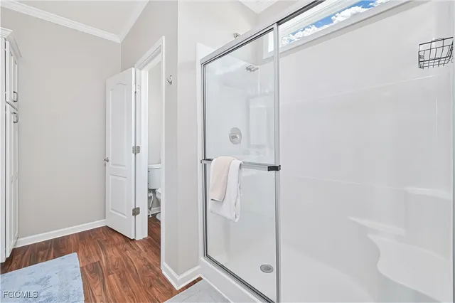a bathroom with a glass shower door