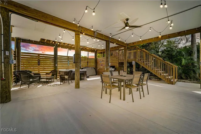 a view of a patio with table and chairs
