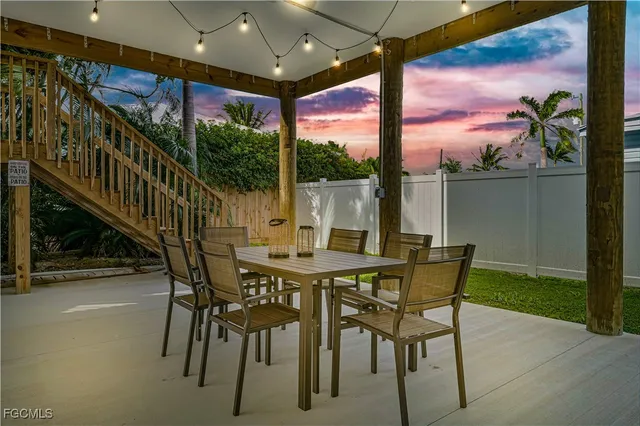 a view of an outside dining space with furniture