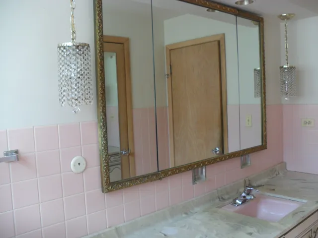 a bathroom with a sink and mirror