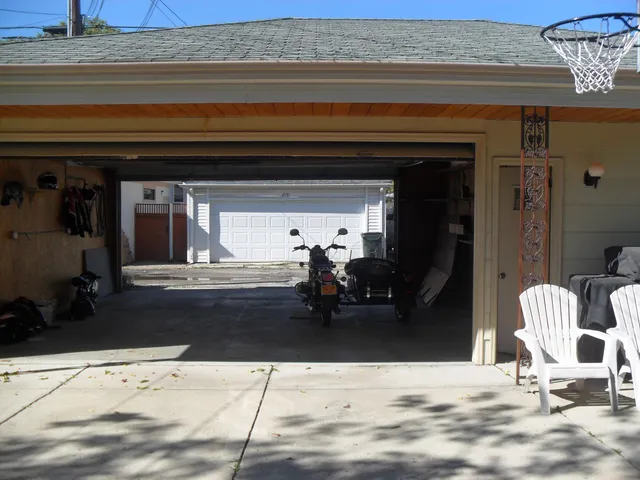 a view of living room filled with furniture and a chandelier