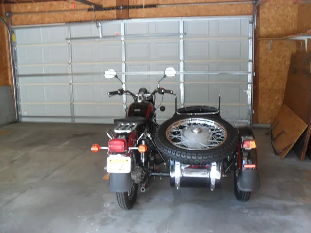 a view of a room with a table and chairs