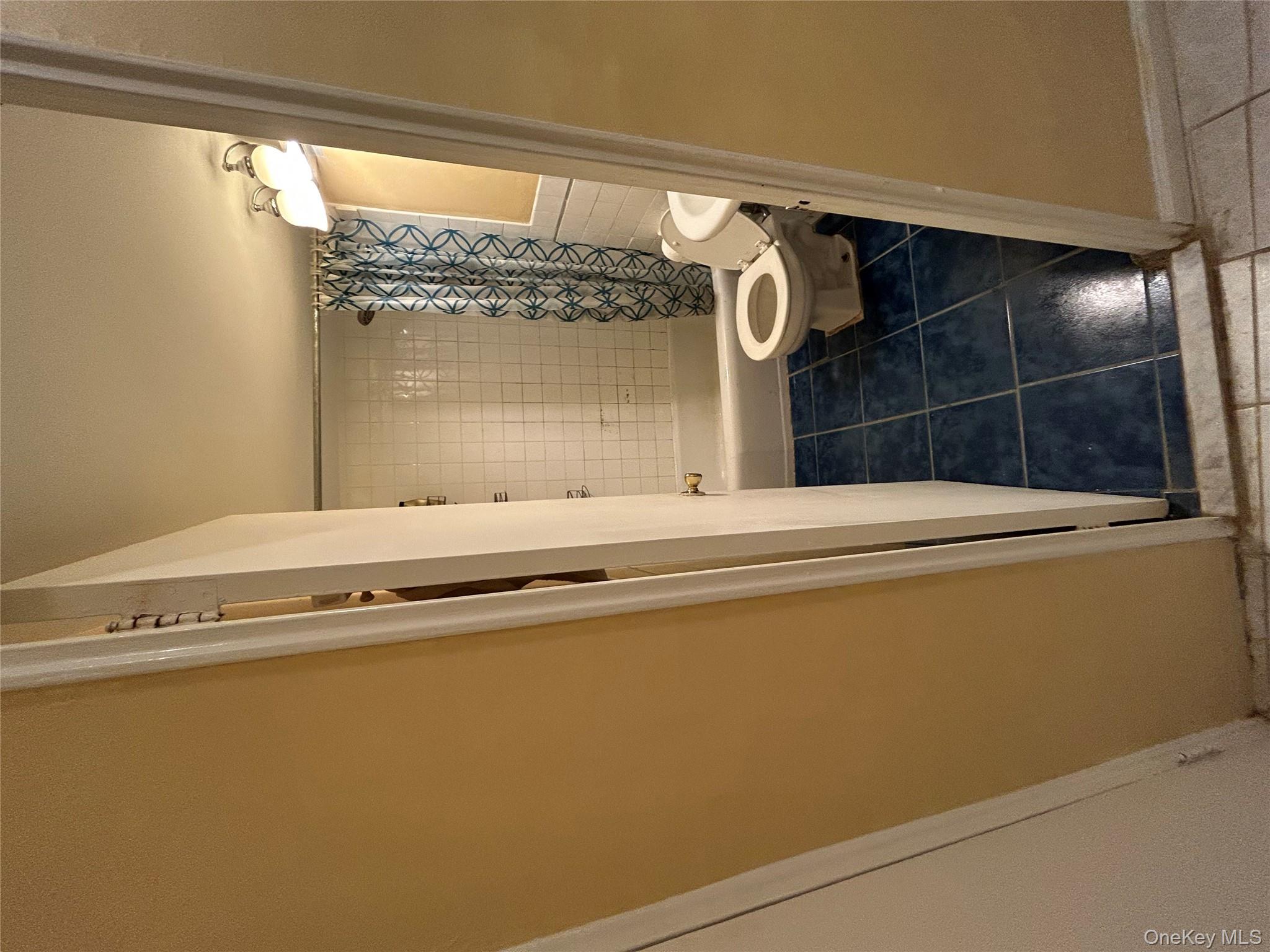 61-55 98th Street, Unit 3A Queens, NY 11374 - Photo 6 of 6 Bathroom with dark tile patterned floors and shower / tub combo