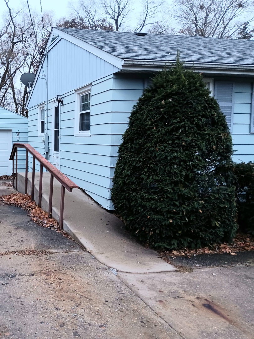 860 Franklin Grove Road Dixon, IL 61021 - Photo 3 of 9 a view of a pathway along the house