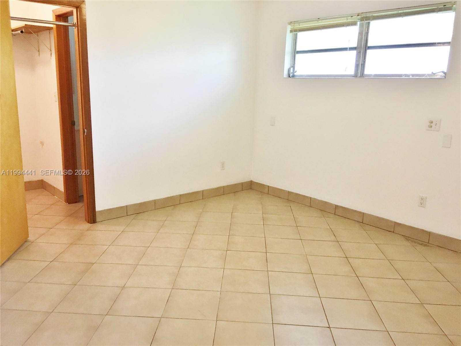 5831 Southwest 62nd Street, Unit WEST Miami, FL 33143 - Photo 14 of 16 a view of empty room