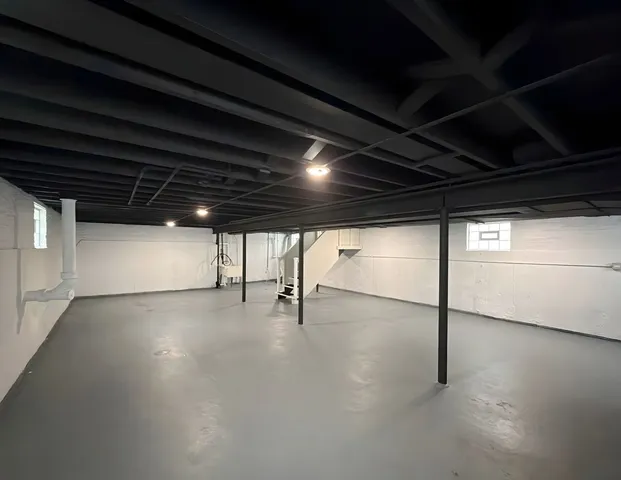 a view of an empty room with windows