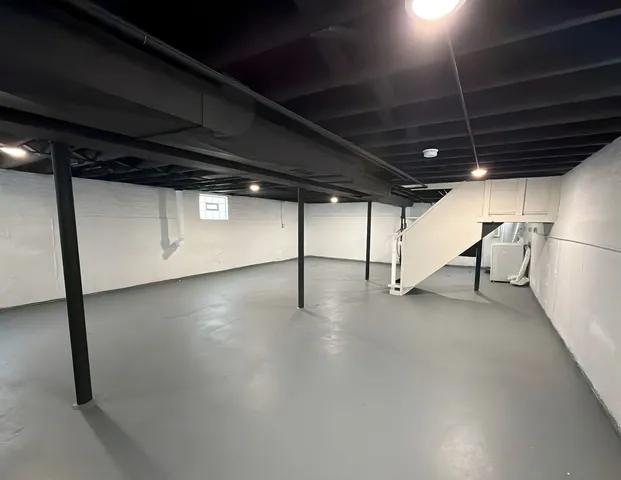 a view of a room with wooden floor