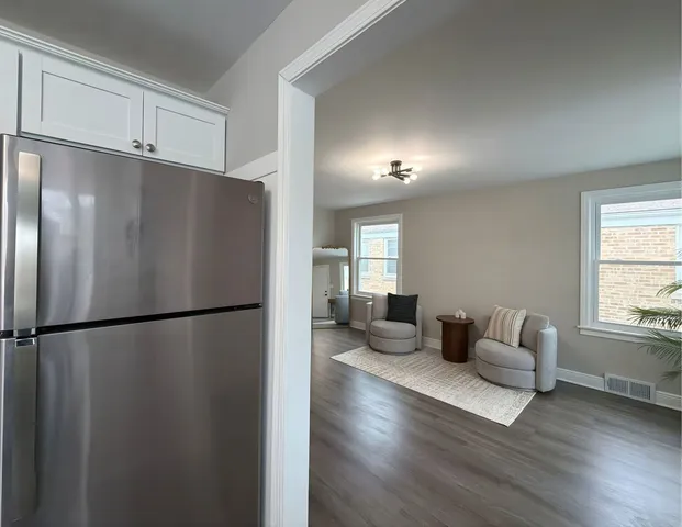 a refrigerator freezer sitting inside of a kitchen