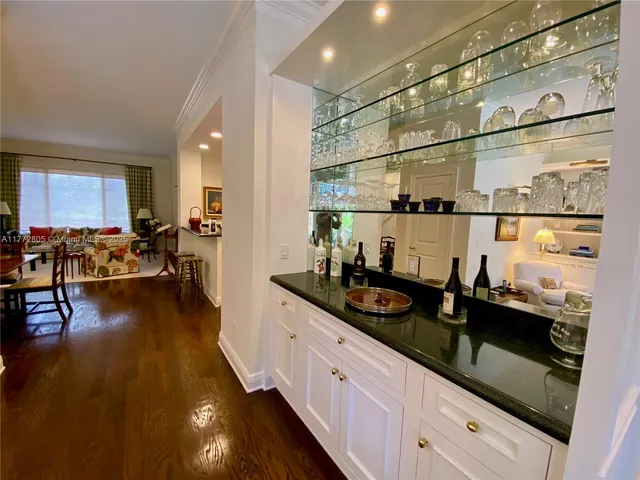 a kitchen with sink and cabinets