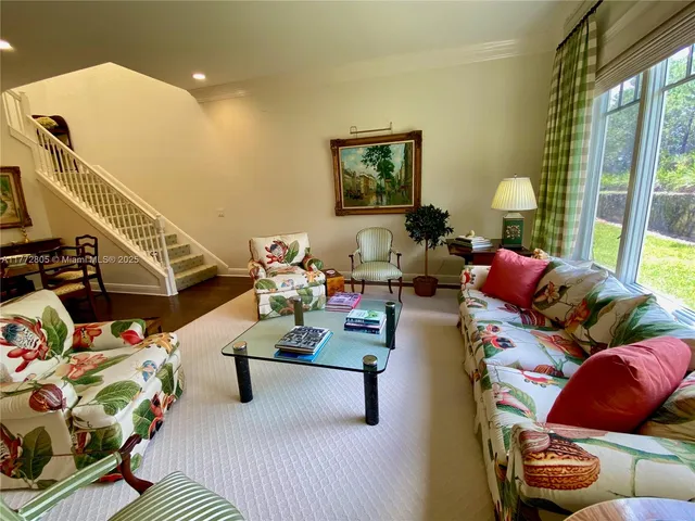 a living room with furniture and a lamp