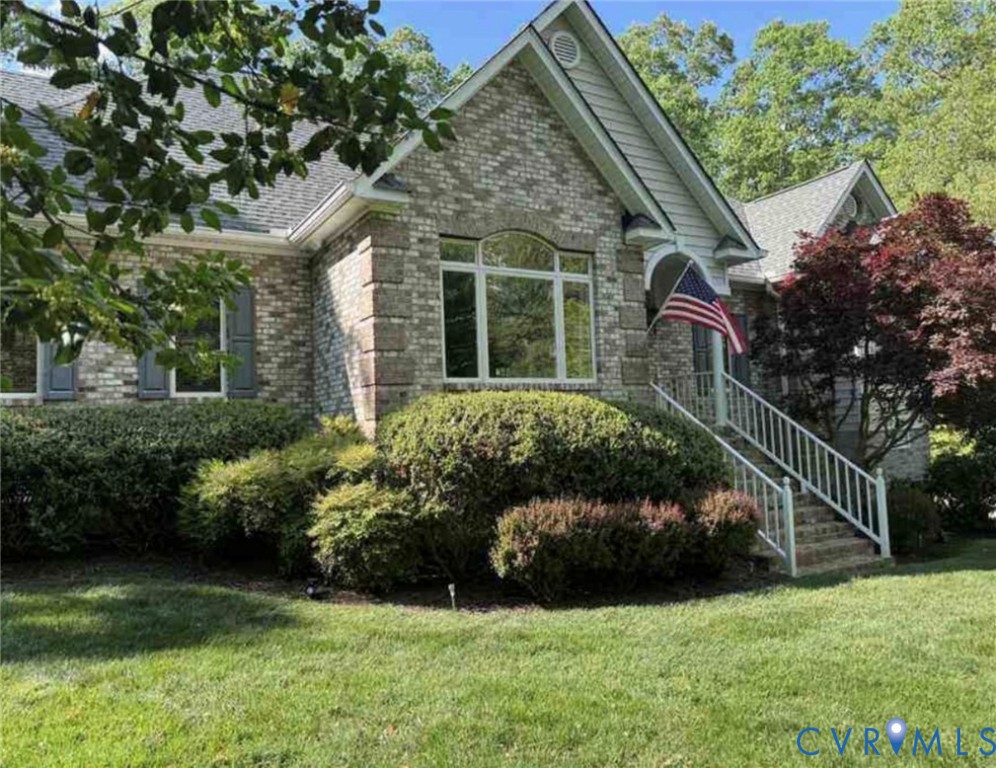 12123 Deer Ridge Court Ashland, VA 23005 - Photo 3 of 63 a view of a house with a yard and plants