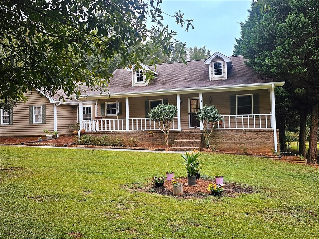 571 Goode Road Conyers, GA 30094 - Photo 1 of 1 a front view of a house with a yard