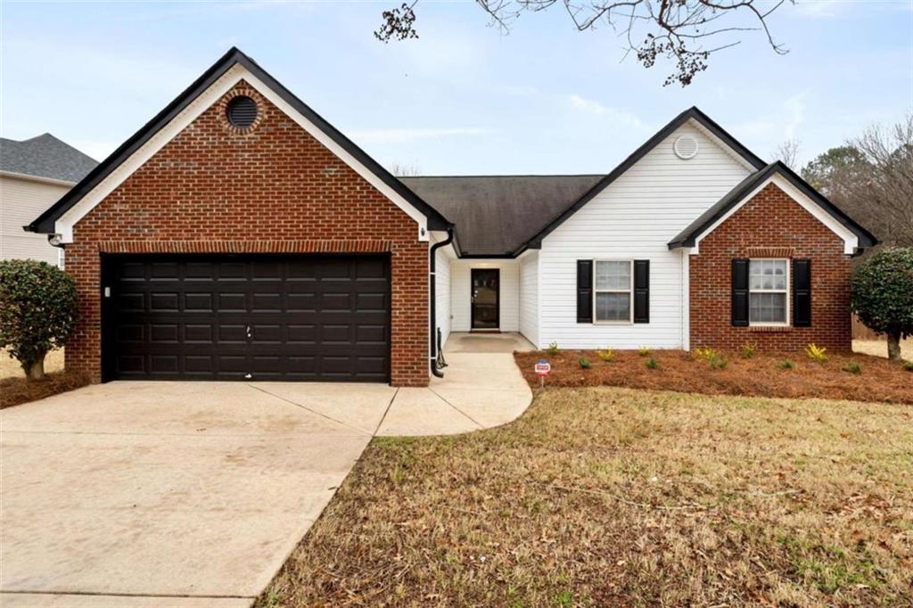 3108 Delaware Loop McDonough, GA 30252 - Photo 1 of 1 a front view of a house with a yard